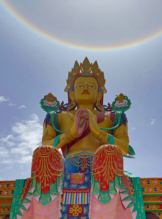 Buddha statue and "sundog" (sun halo), Nubra valley, Ladakh, India