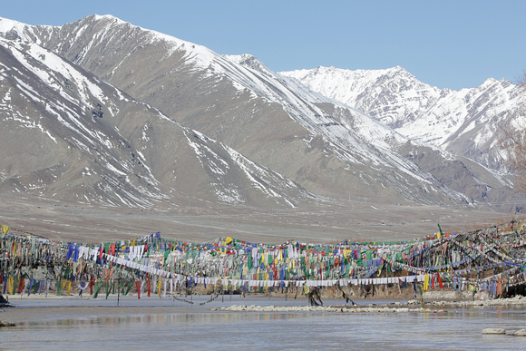 Prayer flags on Indus River bridge, Ladakh, India