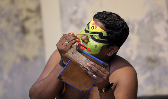 Kathakali performer applying makeup, Cochin, Kerala, India