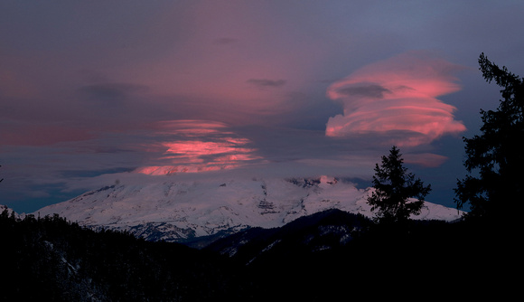 Lenticular clouds and Mt. Rainier at sunrise from White Pass, Washington
