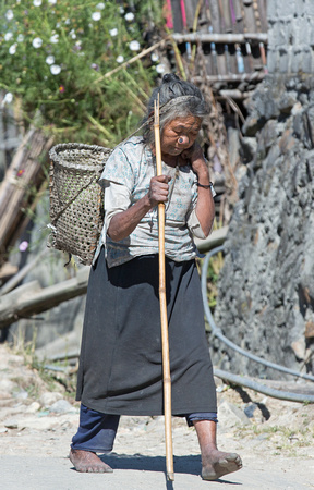 Apatani tribal woman walking, Arunachal Pradesh, India