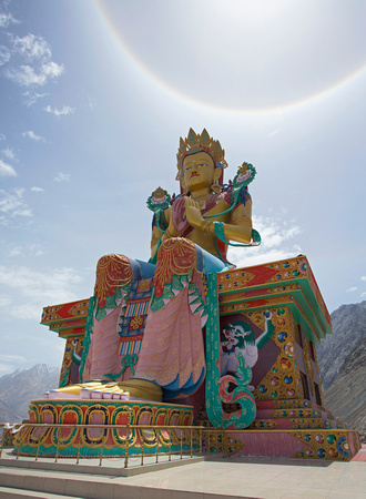 Buddha statue with sun halo above, Diskit, Ladakh, India