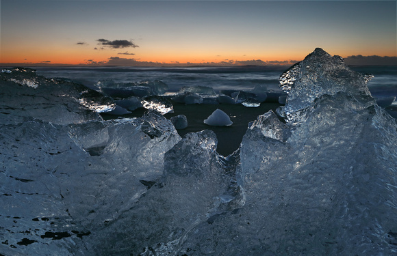 Icebergs on beach just before sunrise, Jokulsarlon, Iceland