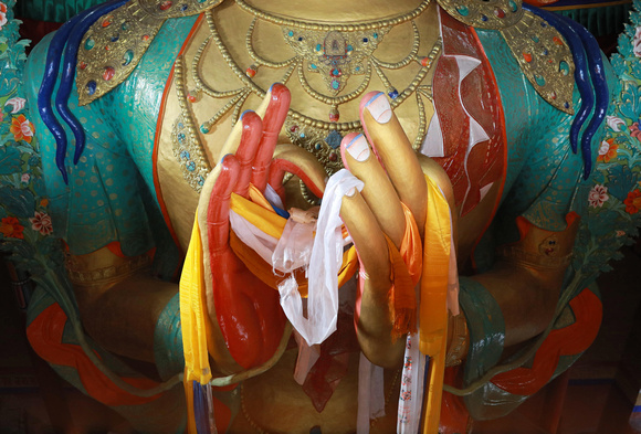 Closeup of hands of Buddha statue, Thiksey Monastery, Ladakh, India