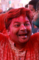Happy red man at Holi, Mathura, India