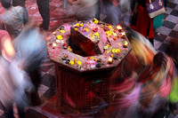 Shrine and crowd motion blur at Holi, Vrindavan, India