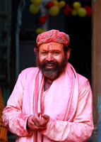 Man in pink, Holi festival, Vrindavan, India