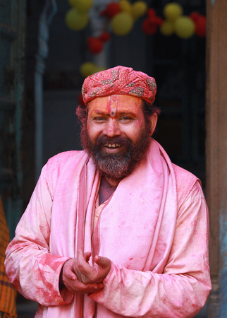 Man in pink, Holi festival, Vrindavan, India