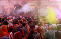 Raucous crowd at Holi festival, Mathura, India