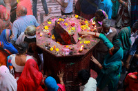 Woman touching shrine at temple, Vrindavan, India